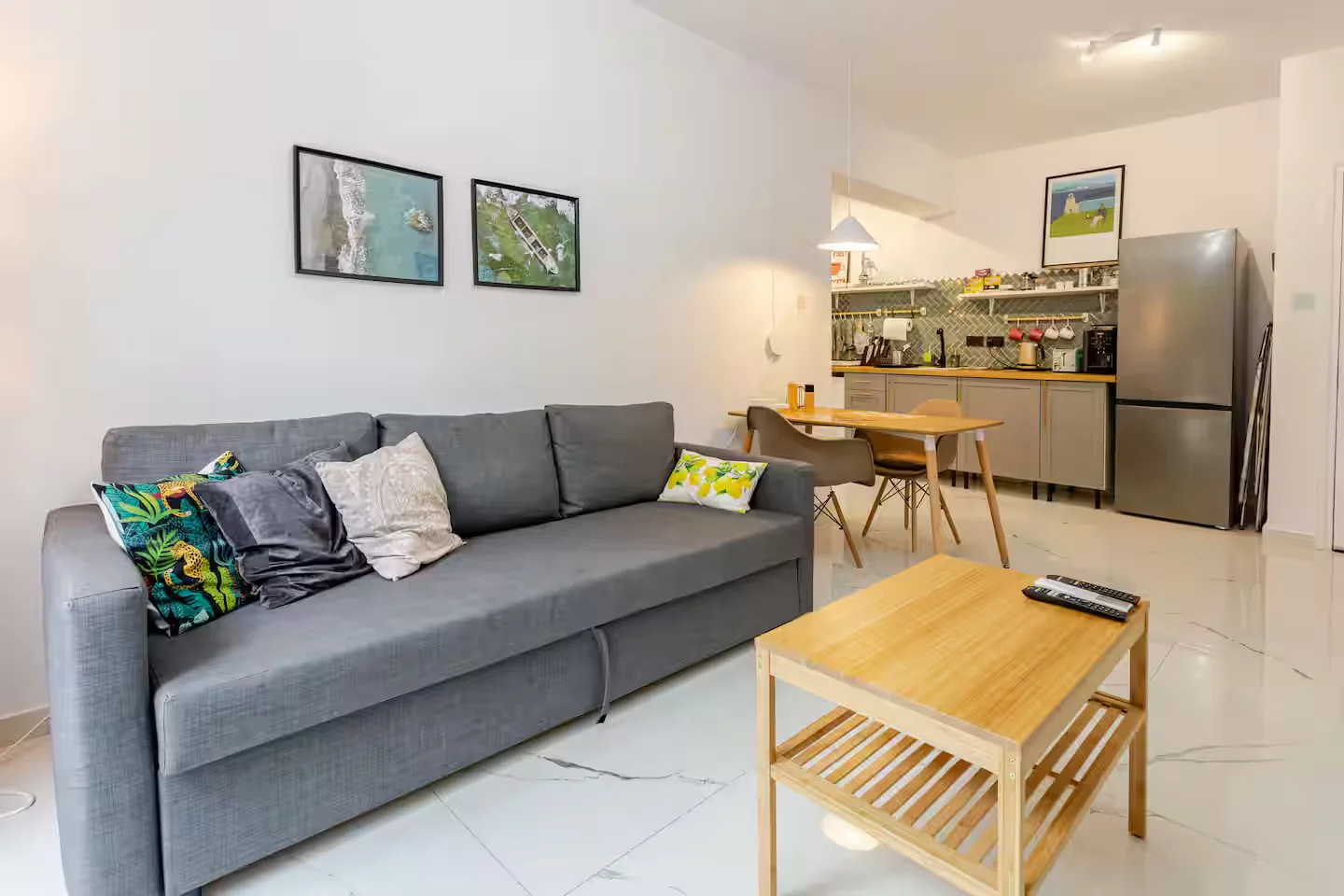 Open-plan living room and kitchen at Margarita Gardens 6