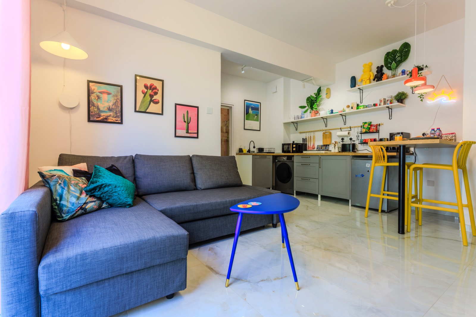Open-plan living room and kitchen at Margarita Gardens 2